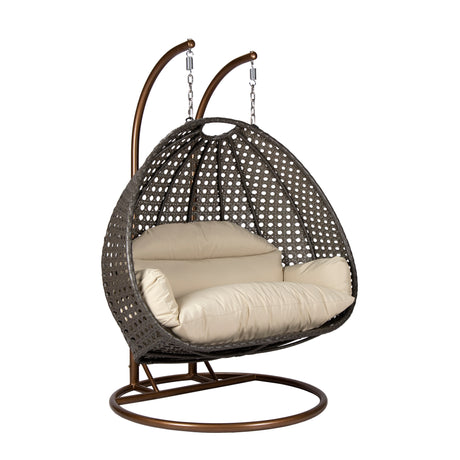 Hangstoel Dubai bruin met goud frame en beige kussen 