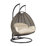 Hangstoel Dubai bruin met zwart frame en beige kussen 