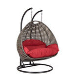 Hangstoel Dubai bruin met zwart frame en rood kussen 