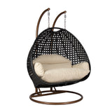 Hangstoel Dubai zwart met goud frame en beige kussen 